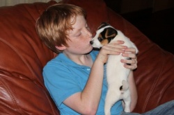 Andrew kissing puppy